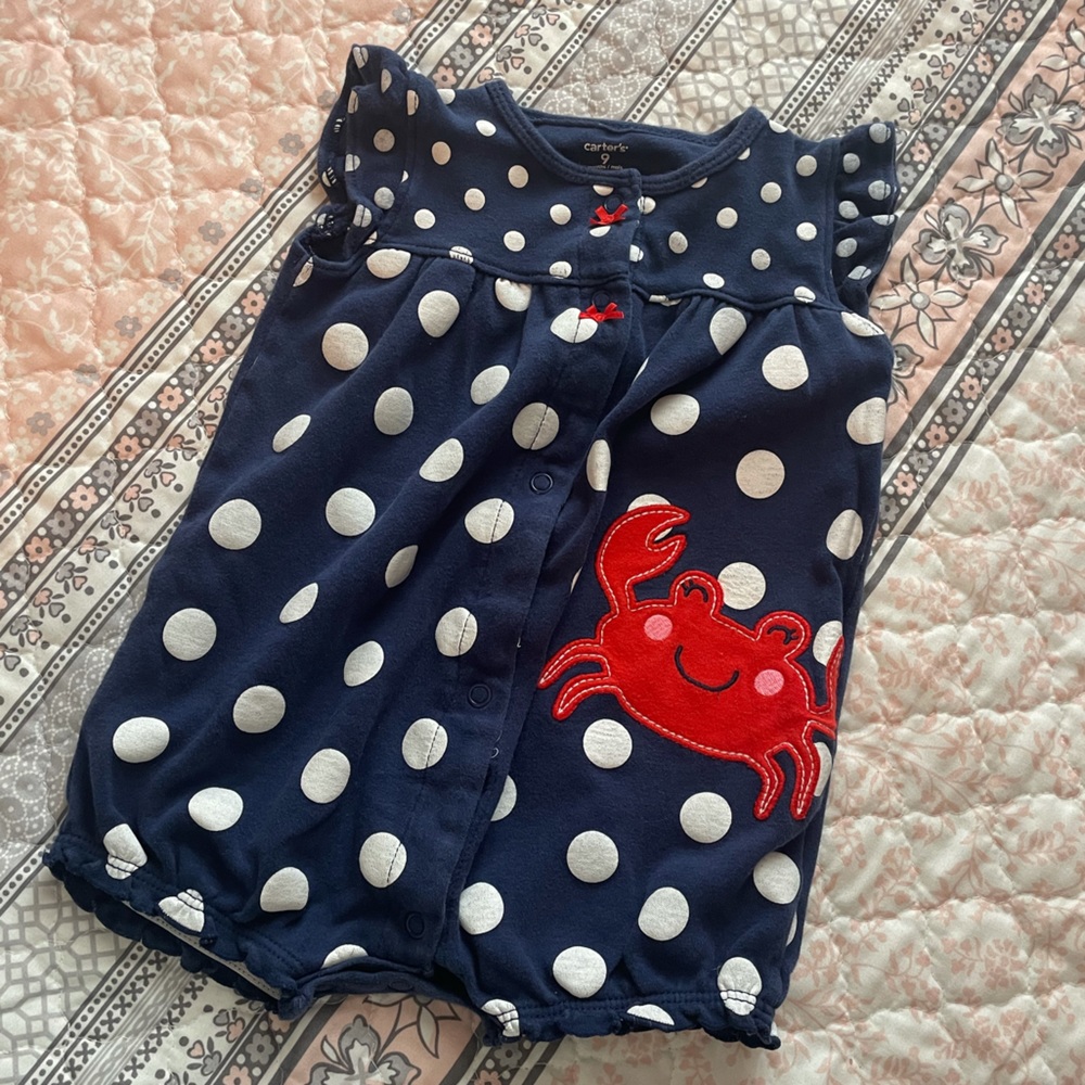 5 for $20-Carter’s Navy/white polka dot romper w/happy crab. Size 9 month.